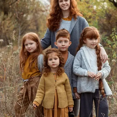 Group of siblings with red hair in an autumn outdoor portrait